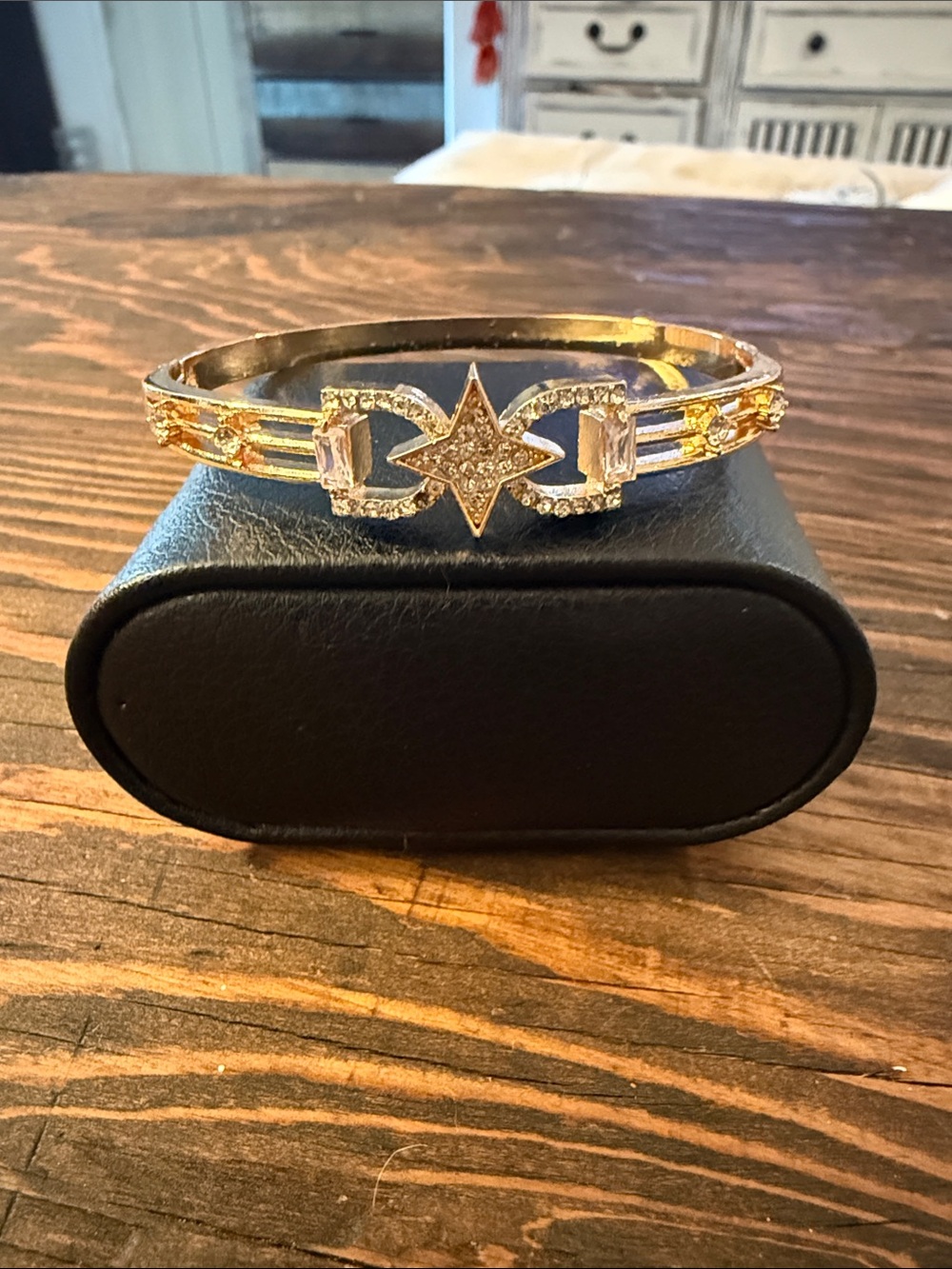 Gold Plated bangle bracelet with star charm and rhinestones